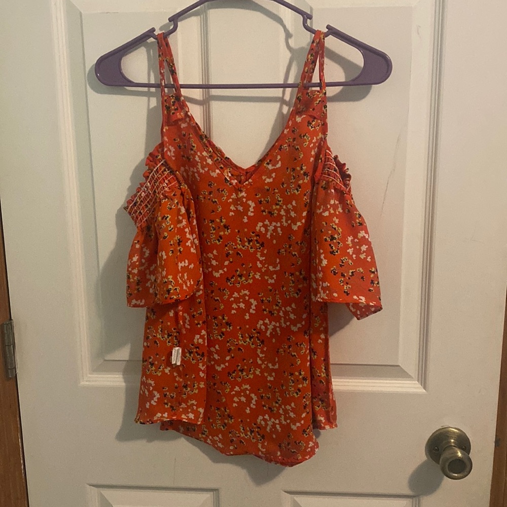 I am selling this red blouse.